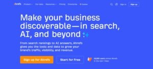 Ahrefs homepage hero section on a bright blue background featuring the headline 'Make your business discoverable—in search, AI, and beyond' with call-to-action buttons for signing up or starting for free.
