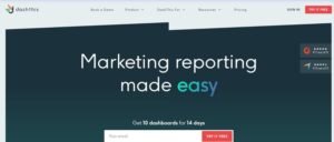 DashThis homepage hero banner titled 'Marketing reporting made easy' featuring a 14-day free trial offer for 10 dashboards, email signup form, and G2 and Capterra review ratings.