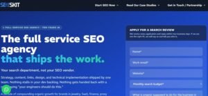 SEOSKIT website header featuring the headline "The full service SEO agency that ships the work" on a dark blue background alongside an application form for a search review.
